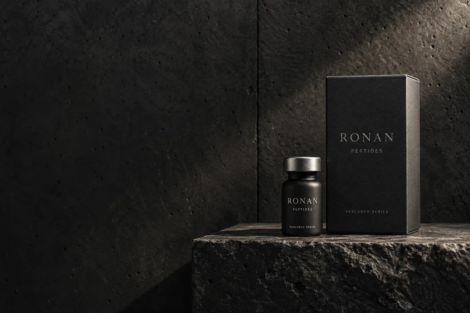 RONAN PEPTIDES matte black vial and packaging on dark stone